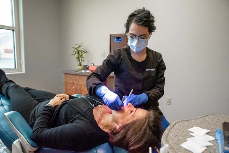 Our Highland Village dentist treating a patient