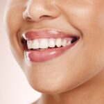A patient smiling to show off their composite veneers in Highland Village, TX data-lazy-srcset=